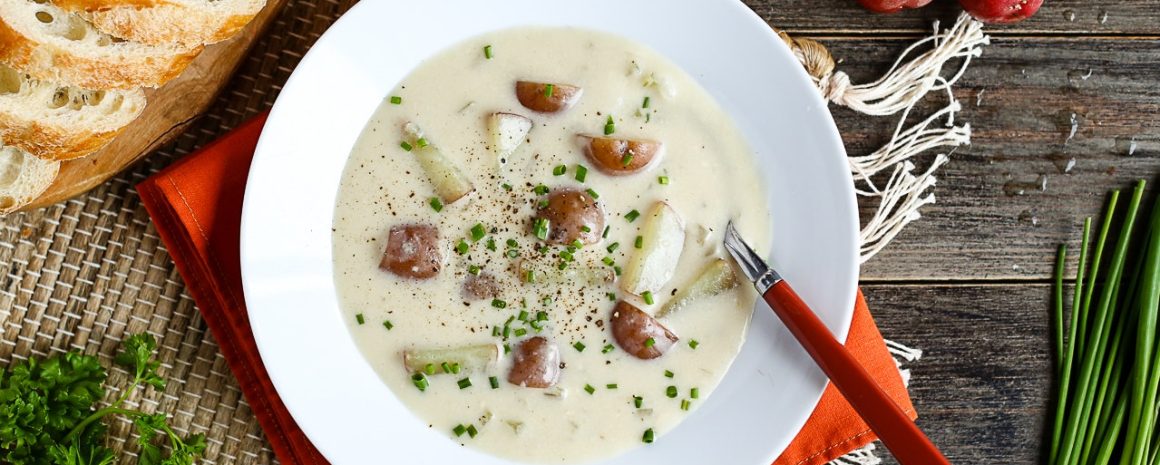 A vegan cream of potato soup in a bowl.