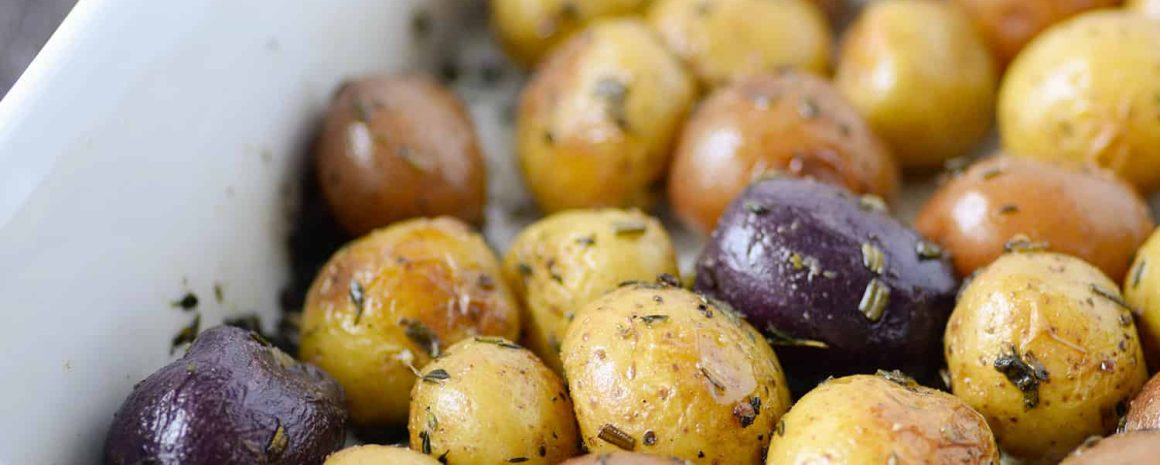 A serving platter of roasted little potatoes.