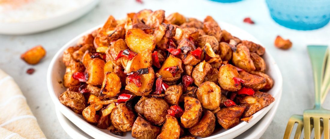 A bowl of Air Fryer home fries made with crispy little potatoes.
