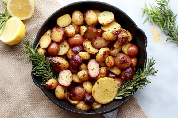 A cast iron pan of potatoes with lemon.