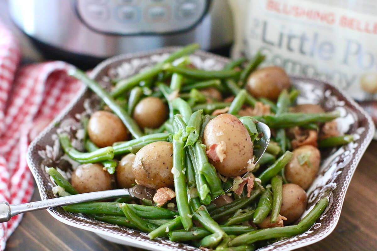 a bowl of Instant Pot Southern green beans with potatoes and bacon.