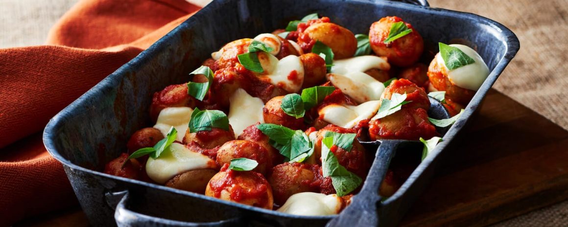 Potatoes poached in tomato sauce.