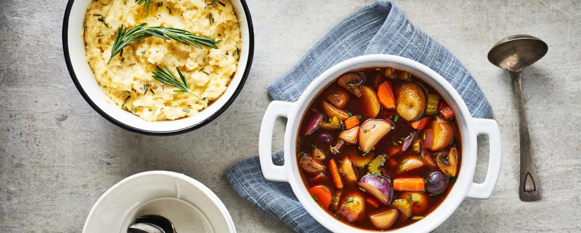 A delicious bowl of slow cooker veggie stew with polenta on the side.